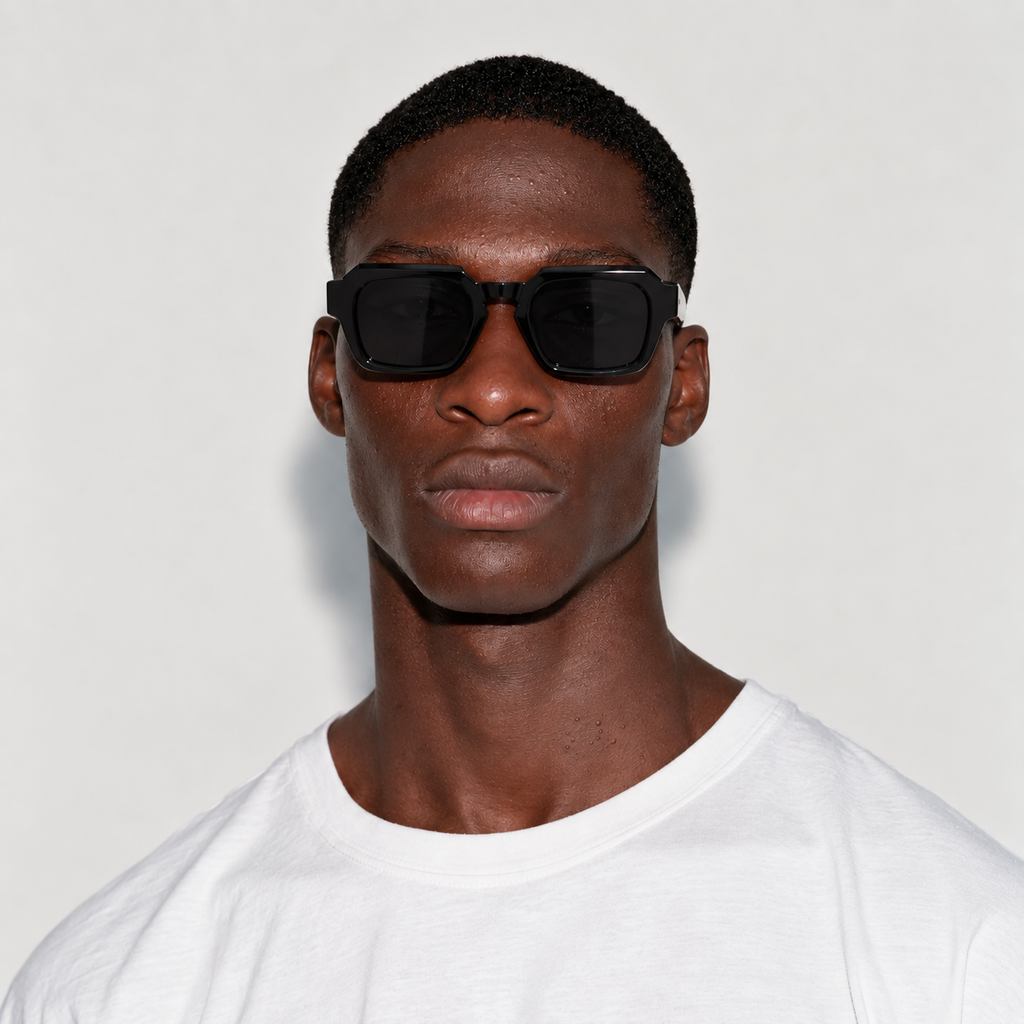 SET 01 — Checkout sunglasses in Black with grey lenses, worn by a model, front