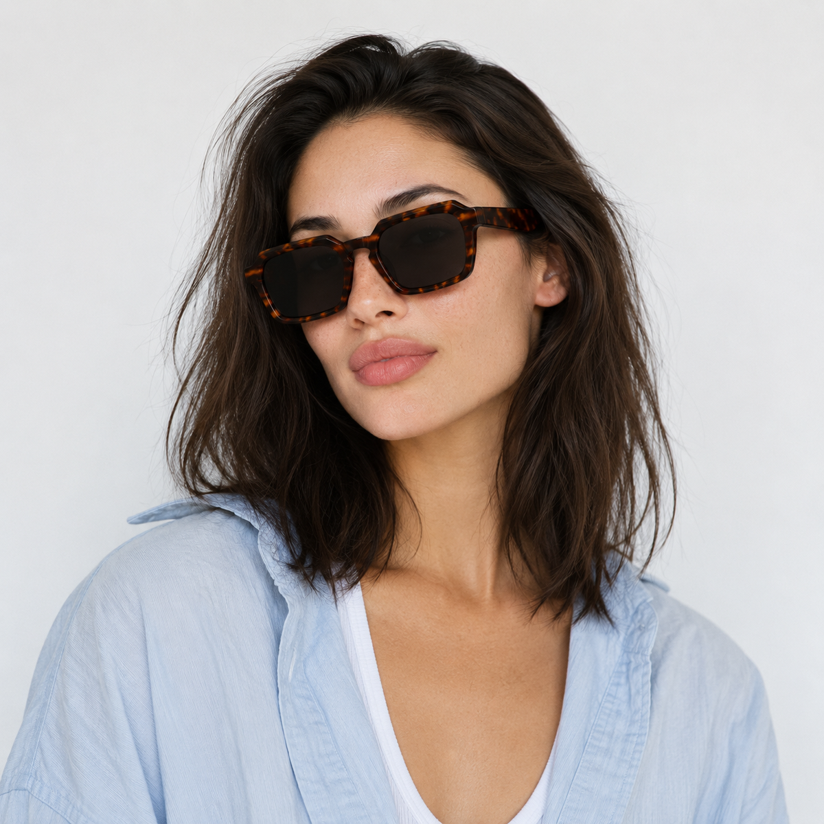 SET 01 — Checkout sunglasses in Tortoiseshell with grey lenses, worn by a model, front