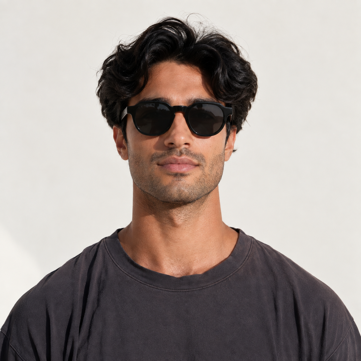 SET 04 — Picnic sunglasses in Black with grey lenses, worn by a model, front