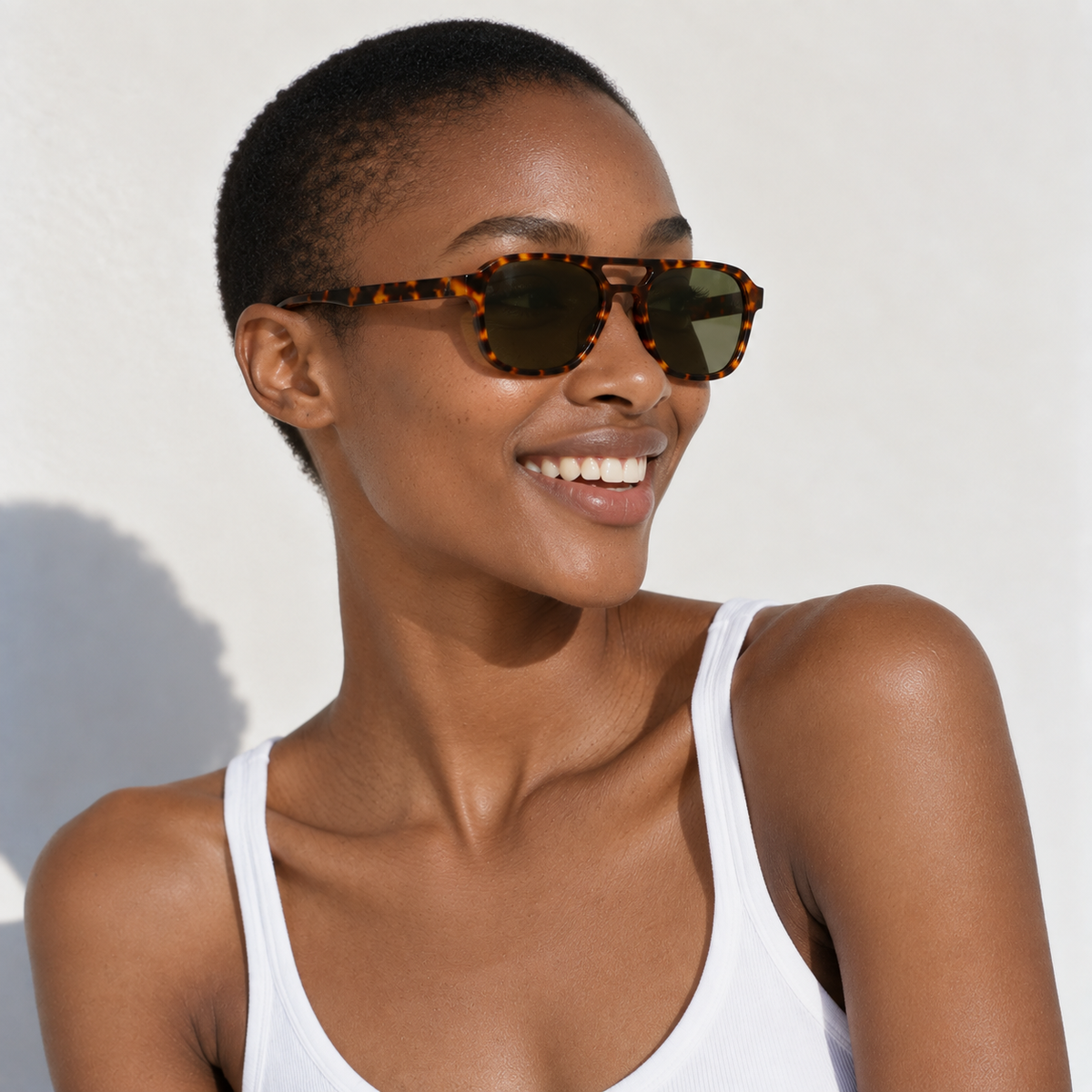 SET 02 — Monday sunglasses in Tortoiseshell with green lenses, worn by a model, three-quarter