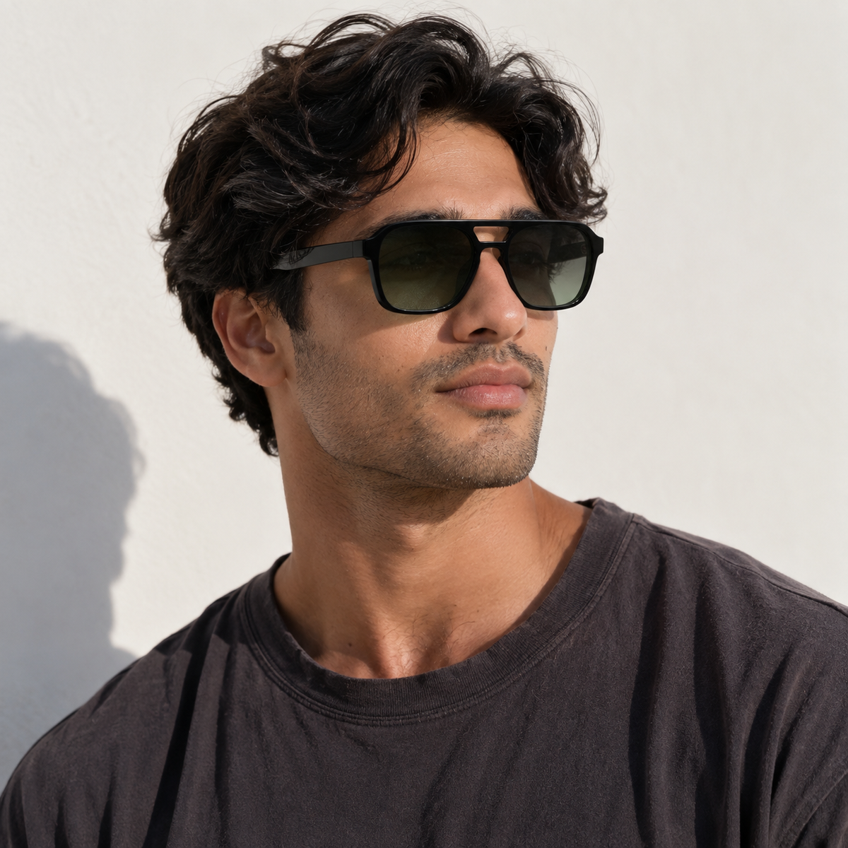 SET 02 — Monday sunglasses in Black with gradient green lenses, worn by a model, three-quarter