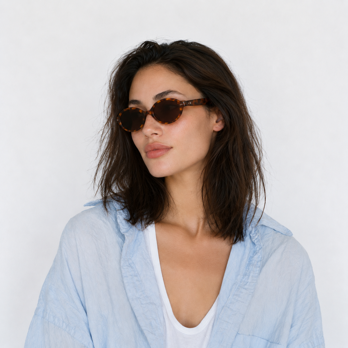 SET 05 — Plus One sunglasses in Tortoiseshell with brown lenses, worn by a model, three-quarter